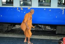 Monk in a train station